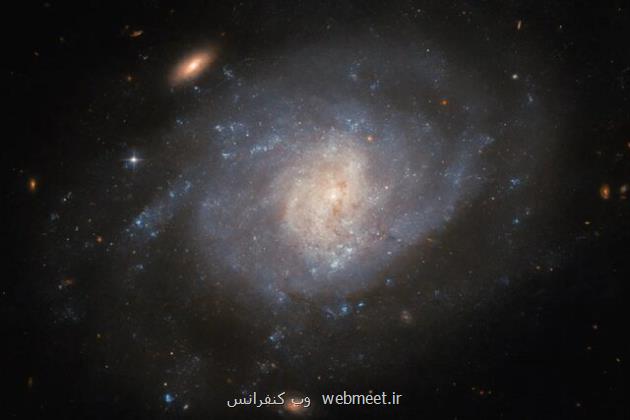 عکس هابل از یک کهکشان مارپیچی با گذشته انفجاری